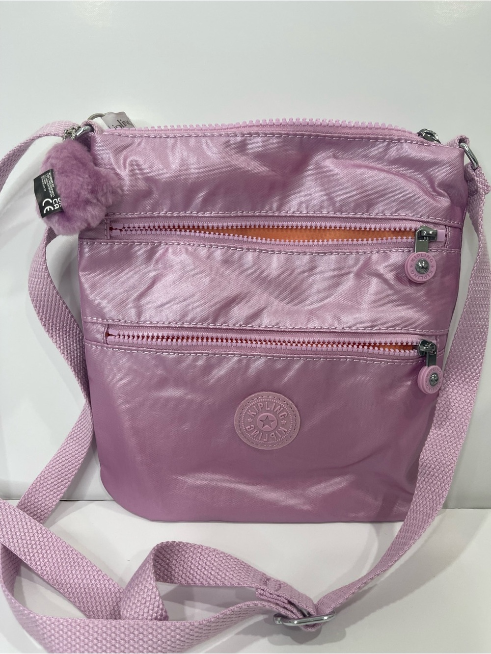 Kipling Shiny Lilac Crossbody Bag with Pom Charm